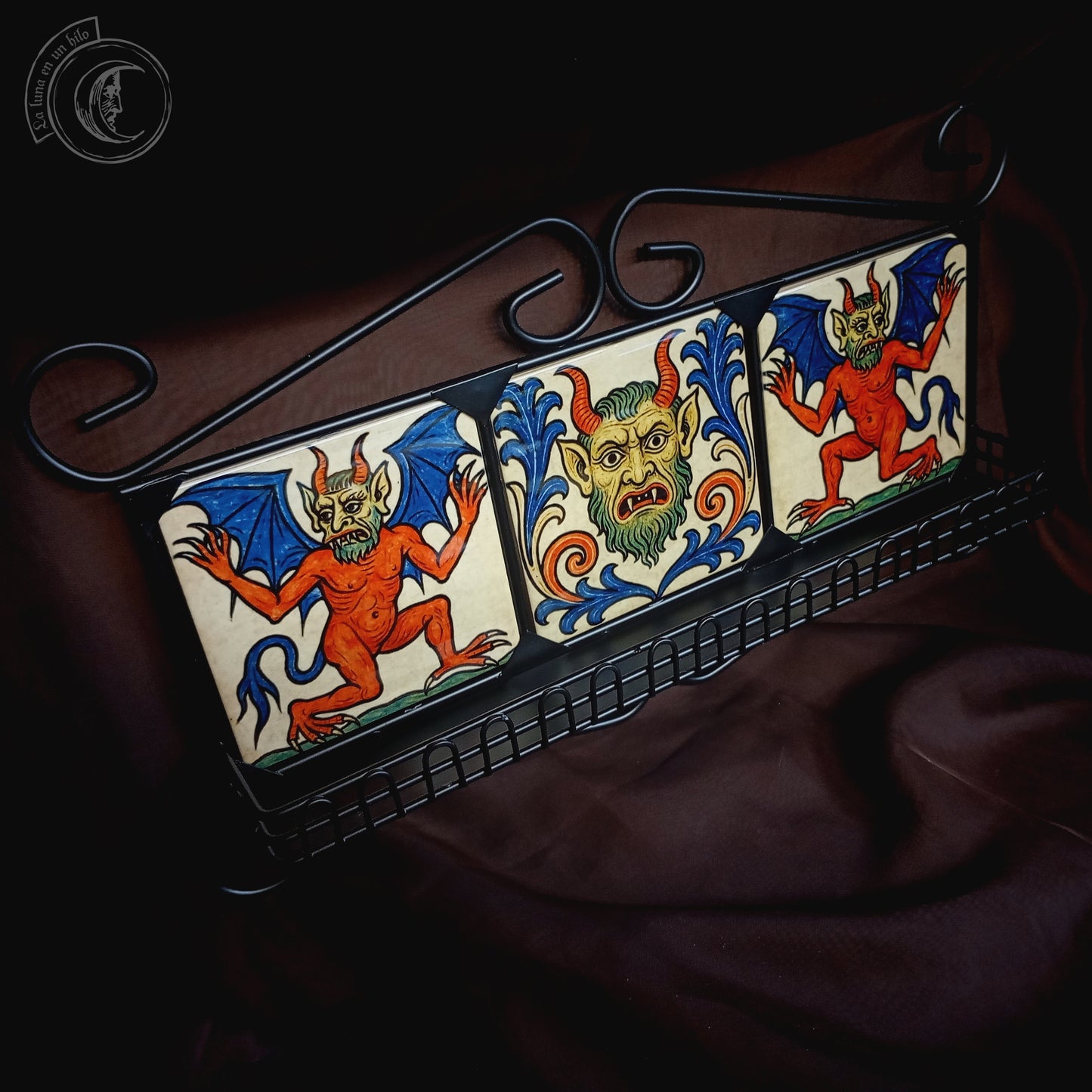 Black iron shelf with 3 medieval demon tiles