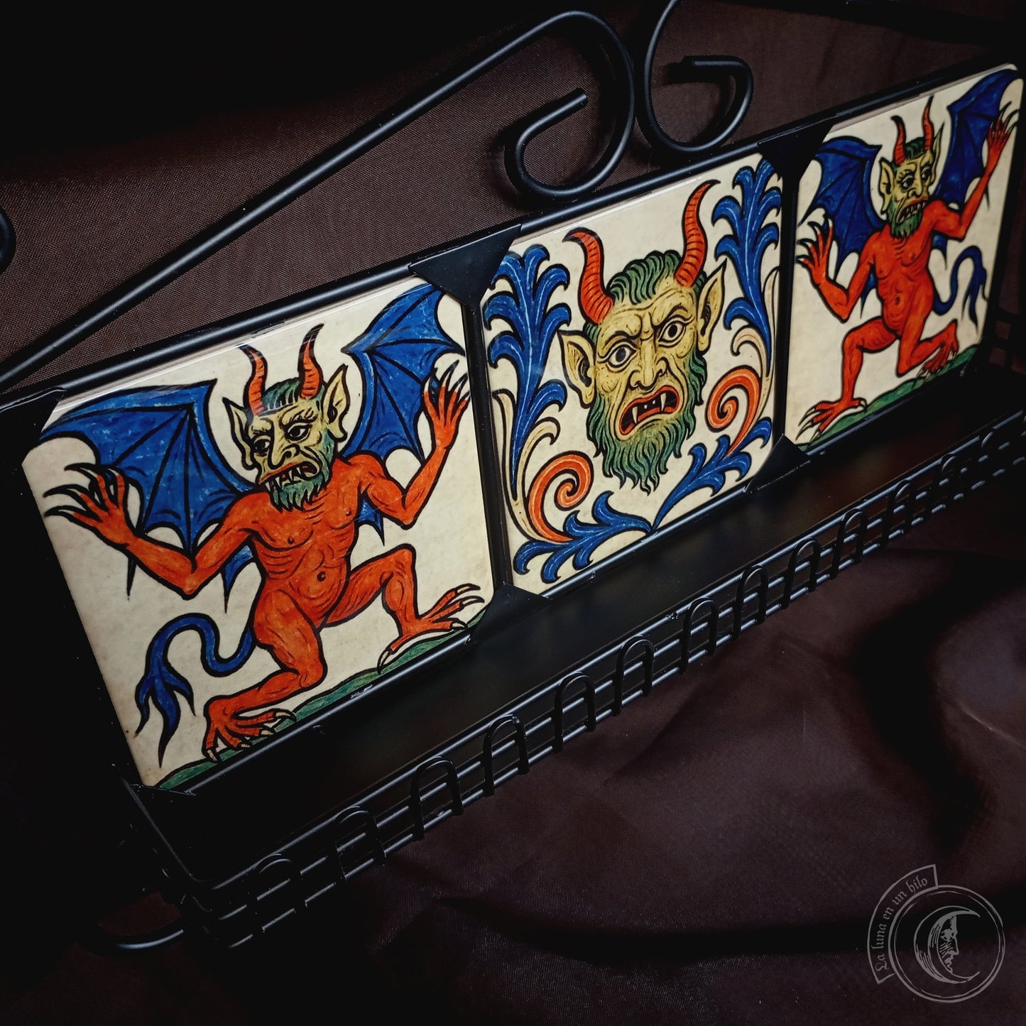 Black iron shelf with 3 medieval demon tiles