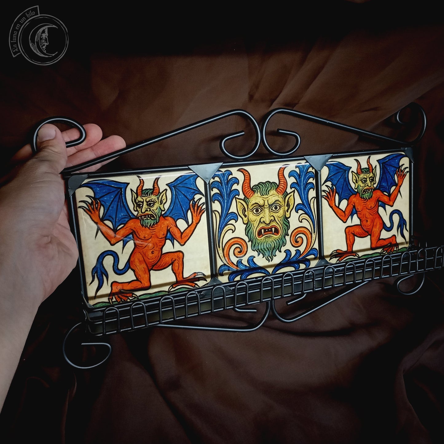Black iron shelf with 3 medieval demon tiles
