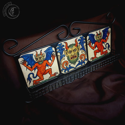 Black iron shelf with 3 medieval demon tiles